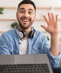 cheerful-man-having-video-call-using-laptop-and-wa-2022-02-03-00-27-59-utc-1024x683